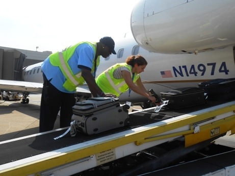 Girl tagging checked luggage, a holiday travel tips