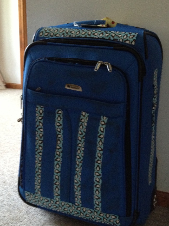 suitcase with decorative duct tape on it in a design