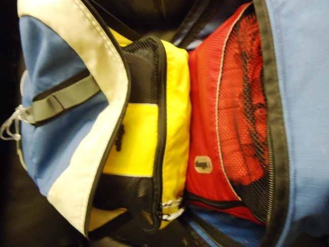 inside look at backpack filled with packing cubes to organize your suitcase