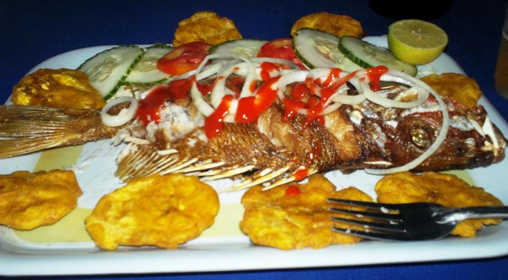 An incredibly fresh seafood dinner (red snapper, salad, and tostones)