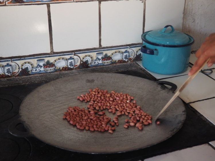 Roasting peanuts for peanut butter (de la gente workshop near antigua, guatemala)