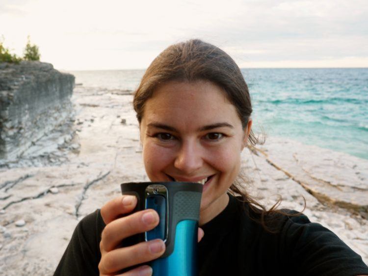 holding contigo mug as a gift idea for travelers