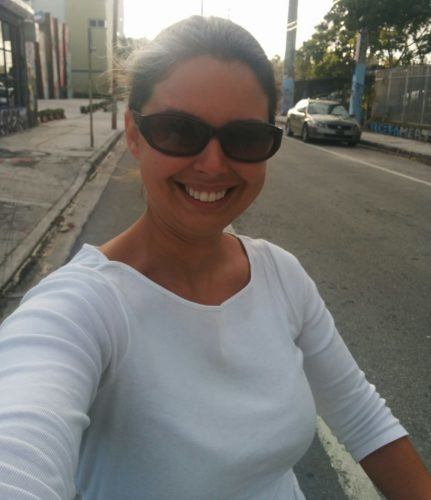 Becky biking in Wynwood Miami on a Miami layover