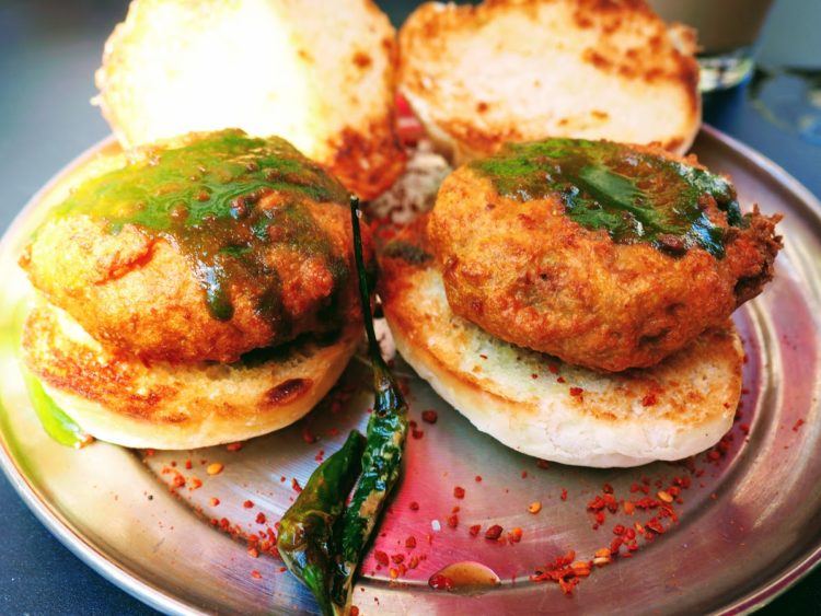 Vada Pav: spicy potato dumplings fried in curried chickpea batter and topped with green and tamarind chutneys at Chai Pani, one of the best asheville restaurants.