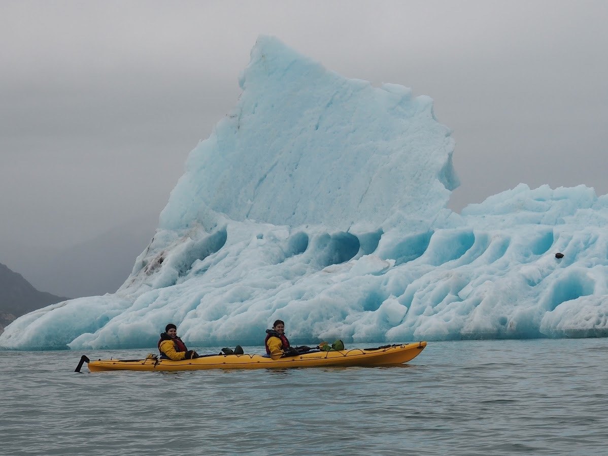 kayaking in alaska - kayak with iceberg