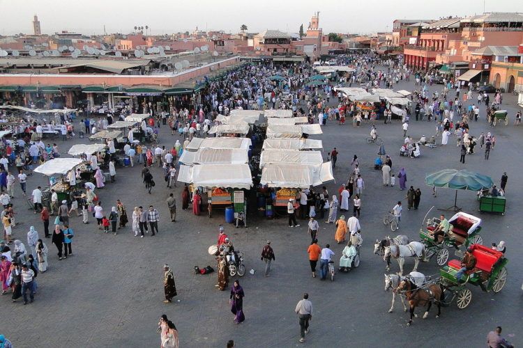 first stop on your two week morocco itinerary is the djemaa el fna square in marrakech, best in the evening