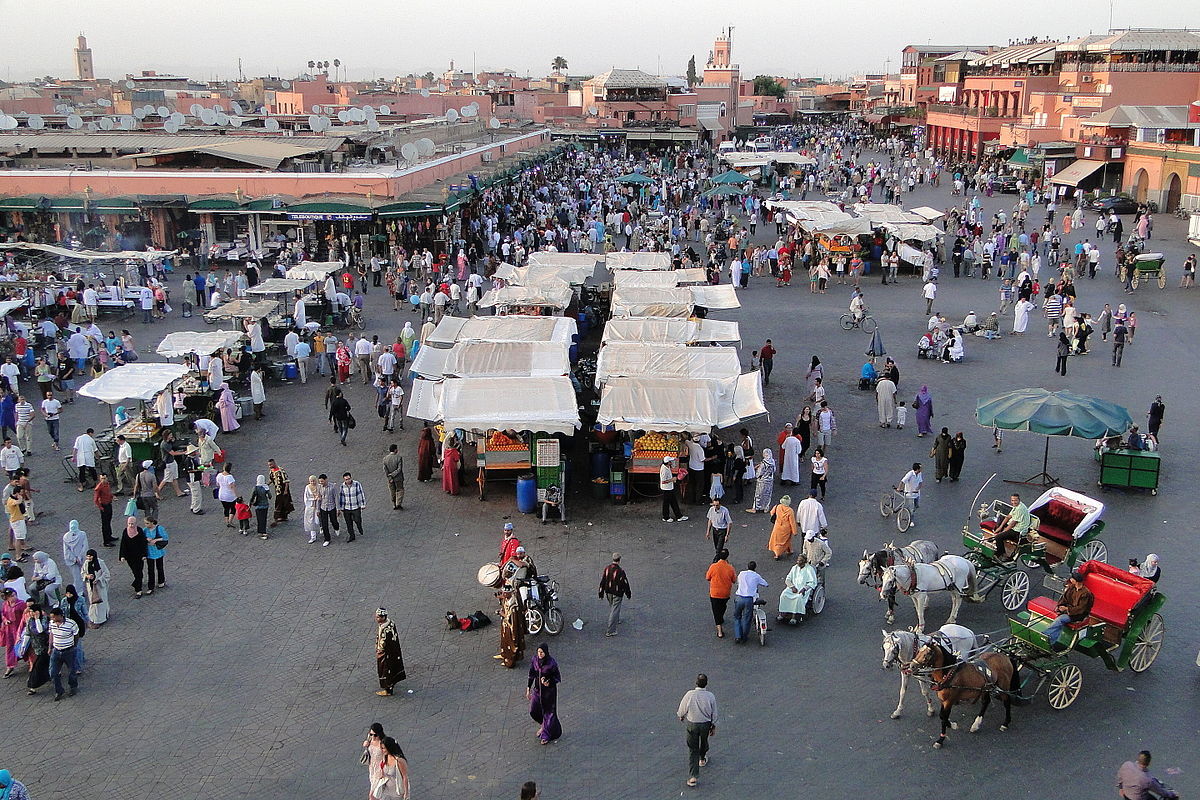 first stop on your two week morocco itinerary is the djemaa el fna square in marrakech, best in the evening