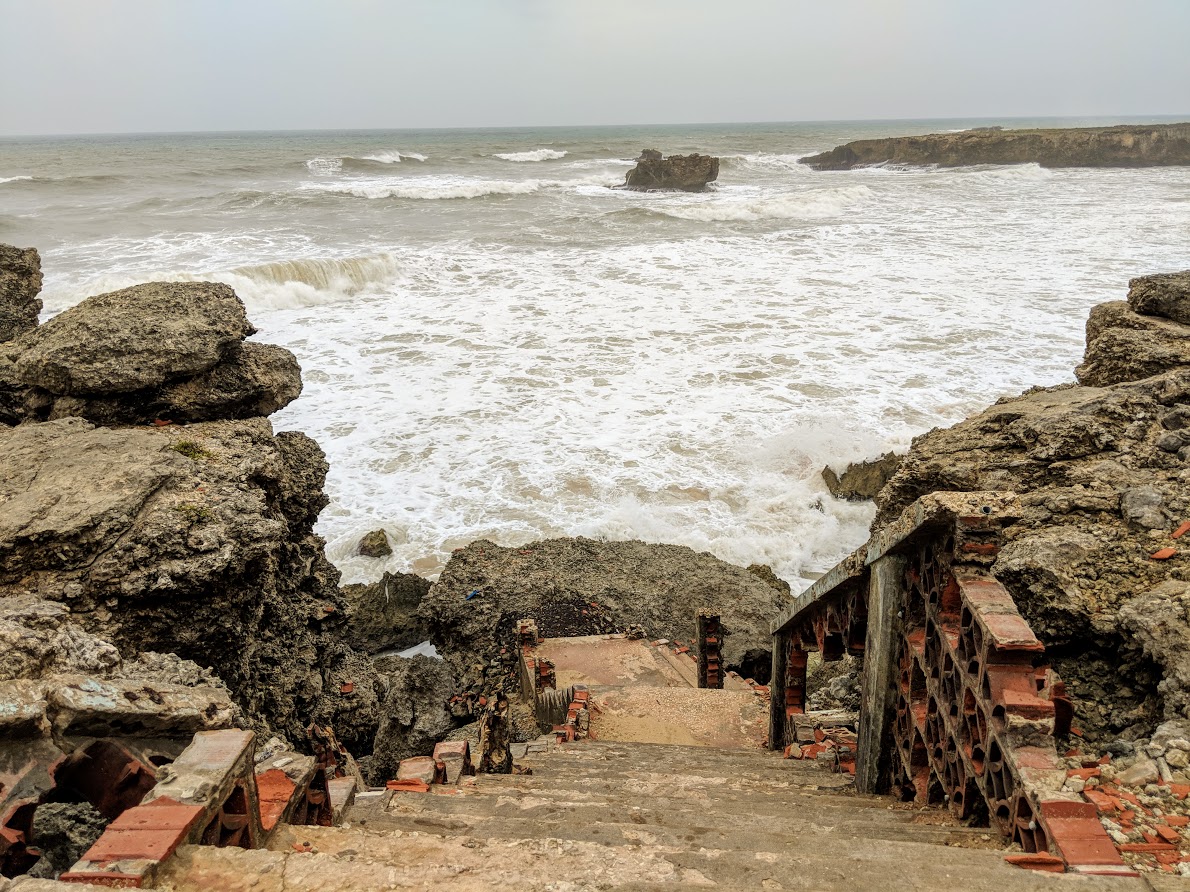 wild waves over staircase and cliffs