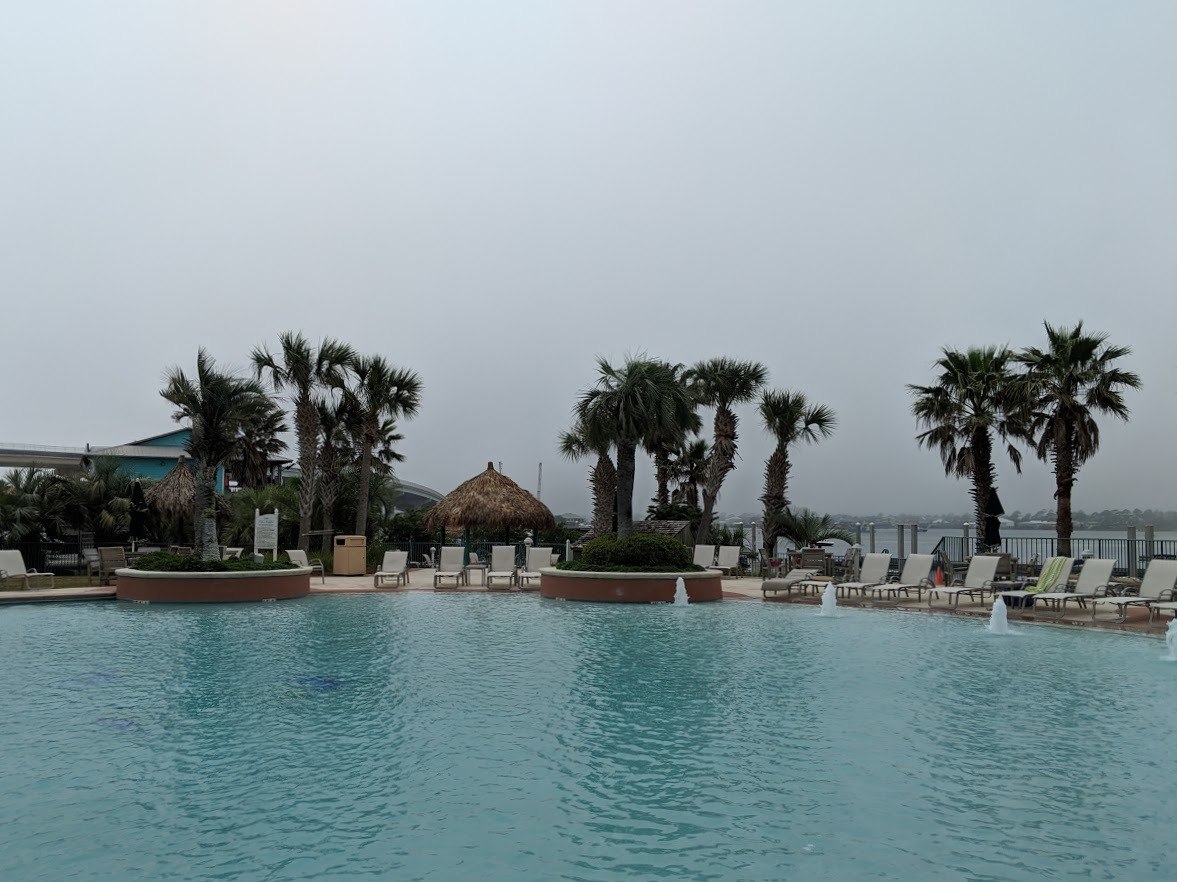 caribe resort pool on a cloudy day