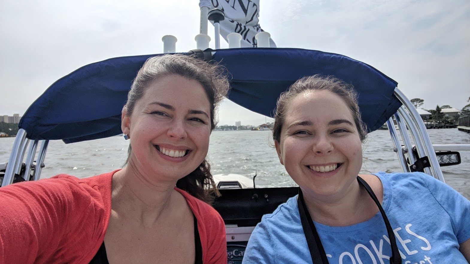 me and my sister on a cat boat in orange beach alabama