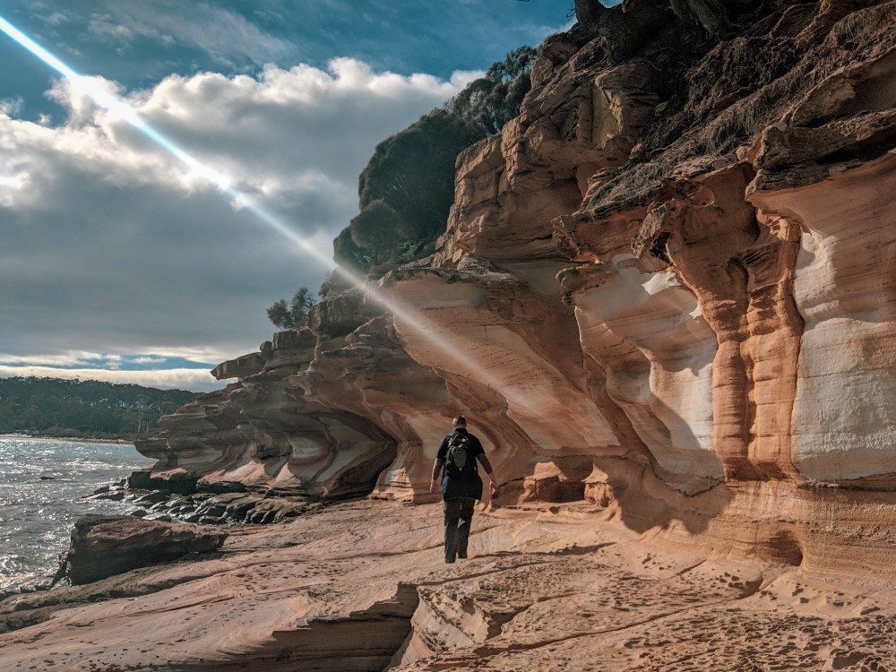 person at maria island painted cliffs