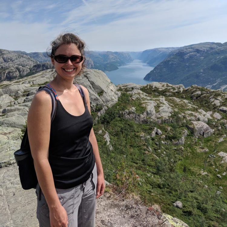 girl wearing tank top and zip off pants in norway