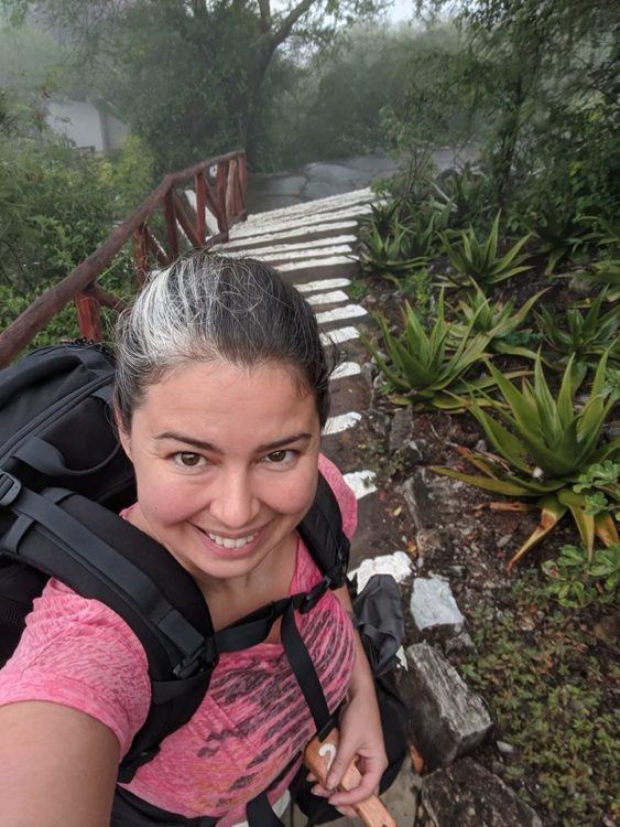 wearing a backpack on the staircase