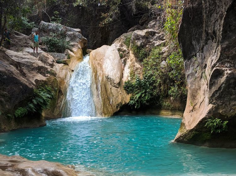 waterfall into blue pool at pozas azules