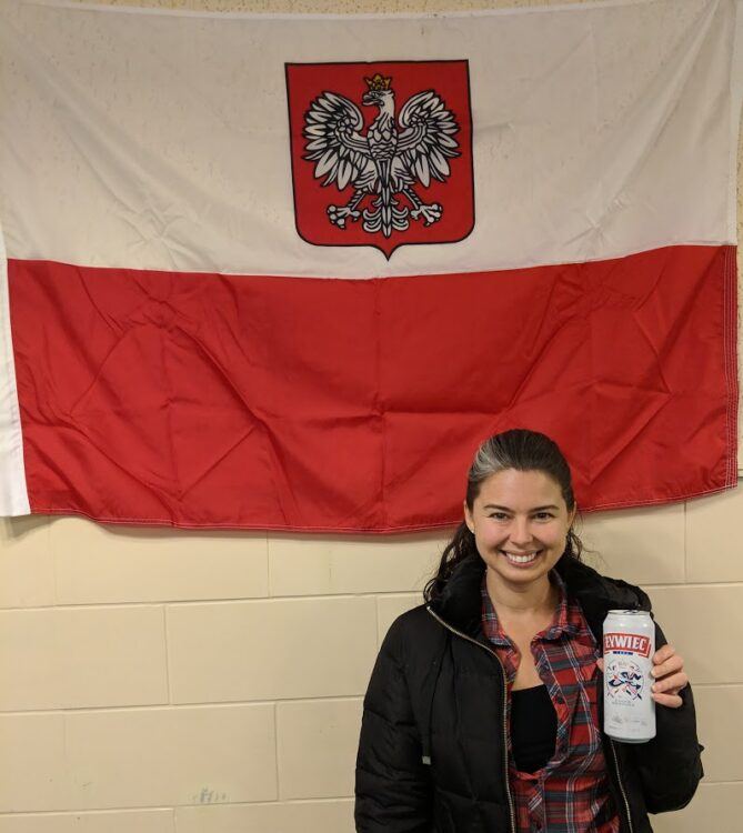 becky holding beer by polish flag