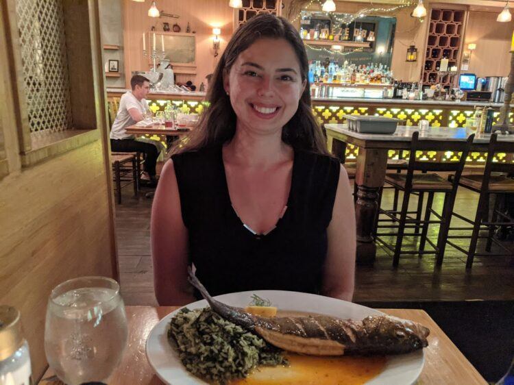 becky eating a big plate of fish at Stella's Restaurant in Richmond, VA