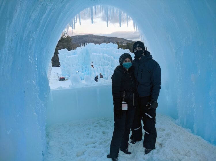 couple posing inside NH ice castle