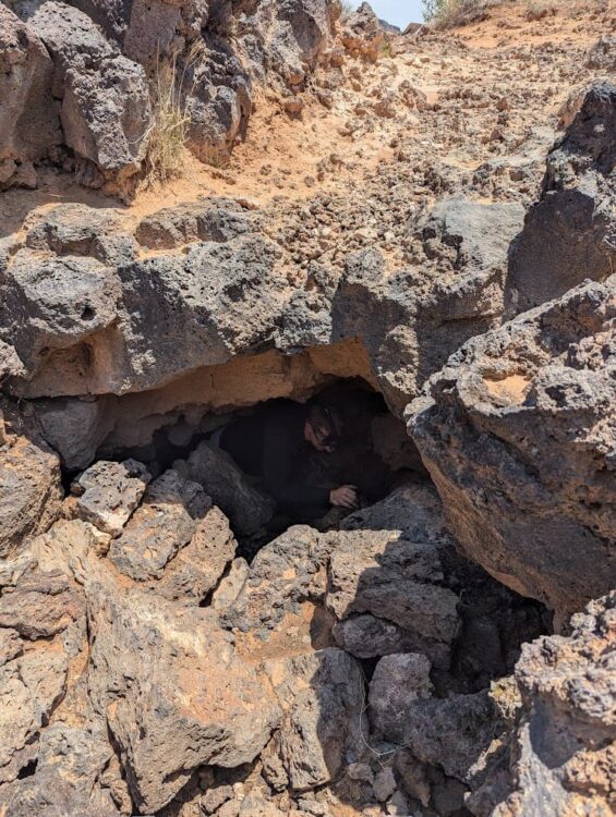 entering a lava tube at snow canyon state park