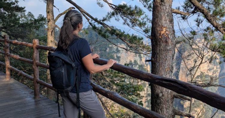 woman looking over zhangjiajie canyon, china